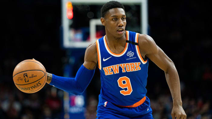 New York Knicks guard RJ Barrett passes the ball against the Philadelphia 76ers